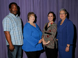 Amber Biondi, second from right, receives congratulations from student nominators Mark Hogan and Lucinda Knier and from President Gilmour.