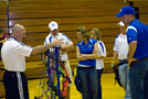 Penn College archery coach Chad Karstetter, right, and Wildcat archers talk with Lycoming Valley physical education teacher Scott Matthews