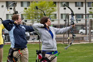 Among the day's shining Wildcats were Kendel Baier, a first-place finisher in women's bowhunter (left), and Eileen McKinney, who placed fourth in the same category. Both were named to the All-East team as a result of their tournament performance.