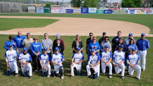 Senior baseball players gather with their families and head coach Chris Howard