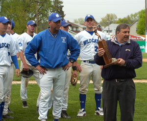 Michael J. Stanzione, Pennsylvania College of Technology athletic director, with Wildcat coach Chris Howard, his men's baseball team and the Penn State University Athletic Conference championship trophy.