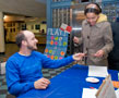 Michael J. Hersh, assistant director of student activities for programming and WEB's adviser, greets a student