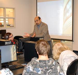Bahram Golshan, an associate professor of computer science at Pennsylvania College of Technology, engages students from the Berks Career and Technology Center.