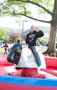 Student Heavy construction equipment technology major Travis M. Cain attempts to conquer the bucking bull