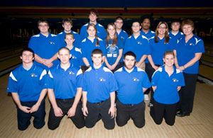 The Wildcat bowling team, with coach Deb Vincenzes (right), during a recent match at Faxon Lanes. (Photo by Kenneth L. Barto, student photographer)