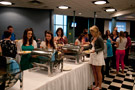 Student-athletes and guests move through the buffet line