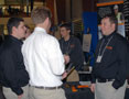 Heavy Career Fair traffic is evident at the Kokosing Construction Inc. booth, where Brett Burgett, right, was among employees recruiting from among Penn College students and graduates