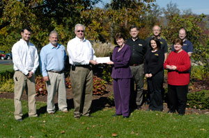 Pennsylvania College of Technology%E2%80%99s School of Natural Resources Management renewed its partnership with Caterpillar dealers, who joined with the Caterpillar Foundation to donate another %2442,000 to benefit students. From left, are Jeremy Olenick, Ransome CAT%3B William P. Kilcoyne Jr., instructor of diesel equipment technology%3B Ron Garber, Ransome CAT%3B Mary A. Sullivan, dean of natural resources management%3B Rusty Steele, Karl Quinn and Walter Chrysam, of Alban Tractor Co. Inc.%3B Dawn Bernitt-Perito, H.O. Penn Machinery Co.%3B and Diane Keefer (in red), from Cleveland Brothers Equipment Co. Inc.
