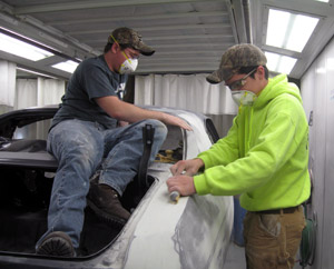 Brock J. Ashman, Harrisonville (left), and Michael P. Garrity, Harveys Lake, collision repair technology students at Pennsylvania College of Technology, work on restoration of a 1970 Chevelle Super Sport owned by the Antique Automobile Club of America Museum. (Photo by Roy H. Klinger, collision repair instructor)