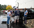 Emily Carella, Adam S. Feather, Azeez Salu, Dj Nicholas and Christy M. Yingling load the truck