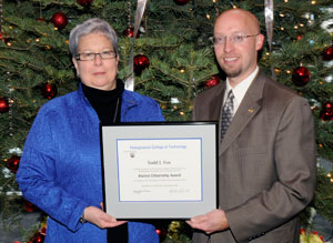 Pennsylvania College of Technology President Davie Jane Gilmour with Alumni Citizenship%2FHumanitarian Award recipient Todd J. Fox, executive director of Greater Lycoming Habitat for Humanity.