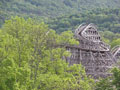 One of Knoebels' popular rollercoasters rises above the scenic greenery