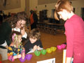 Early childhood students Natashya Sassano and Misty Aikey assist children with magnet races