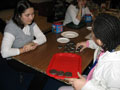Christy Passaretti, another early childhood education major, asks a child to guess how many cookies will fit on a tray