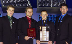 Holding their first-place trophy and plaque are members of Pennsylvania College of Technology%E2%80%99s national championship team of construction students. From left are Brandt D. Hey and Brent K. Hey, of Chambersburg%3B Thomas M. Whitehouse, of Bethlehem%3B and Shane A. Beckner, also of Chambersburg.