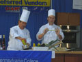 Chef Mike J. Ditchfield and student on the cooking stage