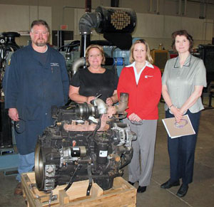 Showcasing a diesel engine donated to Pennsylvania College of Technology's School of Natural Resources Management are, from left, Claude T. Witts, instructor of diesel equipment technology%3B Holly Raesch, Cummins Bridgeway's Pittsburgh operations manager%3B Monica Bateman, a human resources generalist with Cummins Bridgeway in New Hudson, Mich.%3B and Mary A. Sullivan, school dean.