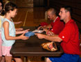 Crosscutters Eryk McConnell (foreground) and Tyler Cloyd sign autographs in Bardo Gym