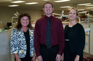 From left, Sharon K. Waters, dean of health sciences at Pennsylvania College of Technology%3B Shawn A. Kiser, director of dental hygiene at the college%3B and Ellen Krajewski, executive director of Susquehanna Health%E2%80%99s Community Health and Dental Center, gather in the college%E2%80%99s Dental Hygiene Clinic.