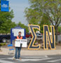 A helpful Sigma Nu member leads the way