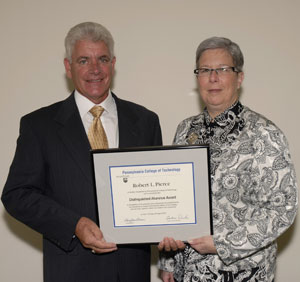 Distinguished Alumnus Award winner Robert L. Pierce and Penn College President Davie Jane Gilmour.