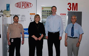 DuPont representatives T.J. Donohue (left) and Brian Albans (second from right) join with Debra M. Miller, Pennsylvania College of Technology%E2%80%99s director of corporate relations, and Colin W. Williamson, dean of transportation technology, in acknowledging renewed support for the college%E2%80%99s collision repair technology program.
