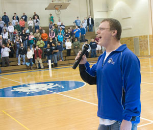 Dylan Lackey, also a member of the men's volleyball team, performs the national anthem.