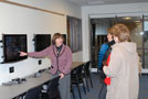 Barbara J. Albert, program specialist, early childhood education, points out the video-monitoring system that allows students to observe youngsters in the nearby Children's Learning Center. Among those braving Tuesday's bitter cold to tour the area were Brenda A. Wiegand, secretary to the special assistant for student affairs/student development (center), and Deb A. Dougherty, secretary to the special assistant to the president for student affairs.