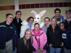 Egg Hunt organizers gather with a special guest.
