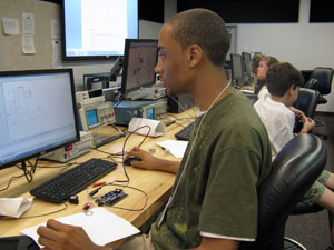 High school student Laquan Williams builds circuits using an FPGA (field-programmable gate array) development board in an electronics and computer engineering classroom at Penn College.