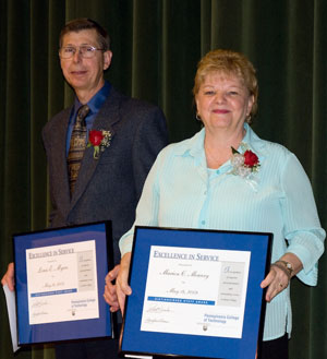 Louis E. Myers, shipping%2Freceiving lead worker%3B and Marion C. Mowery, residence life assistant, with their Distinguished Staff Awards. (A third honoree, Linda M. Morris, was unable to attend and will receive her plaque in the fall.)