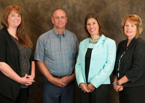 From left, Part-Time Teaching Excellence Award recipient Tammy A. Miller and Distinguished Staff Award winners Edward J. Bergstrom, Kathy S. Wurster and Sue A. Mahaffey.