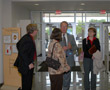Senior Vice President William J. Martin shows off the Madigan Library to, from left, Daniel R. Hagen, Pamela P. Hufnagel and Karen L. Duncan