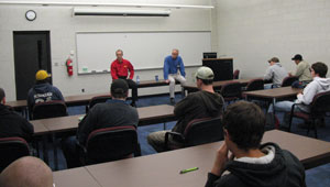 Pennsylvania College of Technology students hear from Karl Quinn, of Alban Tractor Co. Inc. (in blue shirt) and Randy Fetterolf from Cleveland Brothers during an informal session of the Student Success Program.