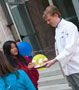 Culinary arts technology student Stephen W. Malizia offers cupcakes to passersby