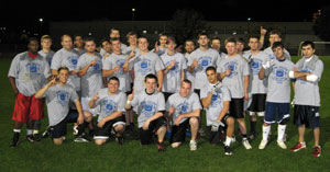 Participants in Thursday's Homecoming Flag Football game assemble for a group photo under the Athletic Field lights. (Photo provided by Jeremy Bottorf, intramural assistant)