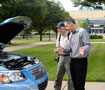 Robert R. Wimmer, national manager, energy and environmental research group, Toyota Motor North America, explains the FCHV to Williamsport Sun-Gazette photographer Mark Nance
