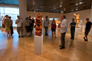 Attentive summer crowd attends exhibit's opening