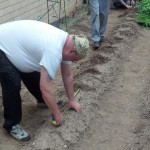 Le Jeune Chef Head Cook/Sous Chef Troy A. Breger measures distance between plants