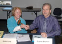 Eugene M. McAvoy passes the gavel to Gerri F. Luke, incoming chair of College Council