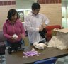 Helena N. Yancey, Student Activities information center clerk, and Student Government Association President Andrew S. Wisner make stuffed animals in the Campus Center