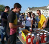 Kattie Heisey from Sigma Sigma Sigma and Frank Meise Jr. from Sigma Nu serve freshly grilled burgers and hot dogs to students