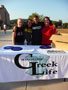 Alpha Sigma Alpha's Ashlyn Hershberger, Lyndsey Royek and Crissy Reed join Sigma Pi's John Keenan at the sign-up table