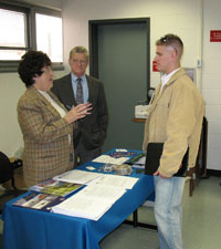 Helicopter Association International representatives talk with a student at the Lumley Aviation Center.