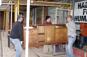 Pennsylvania College of Technology Construction Management Association students Ryan P. Becker, Sean J. Scully, Tomasz Jezowski and Courtney L. Shreiner do some heavy lifting during Greater Lycoming Habitat for Humanity%E2%80%99s recent move in Williamsport.