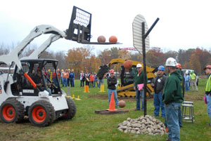 A participant in the skid-steer basketball contest, one of seven events in the Oct. 24 Precision Heavy Construction Equipment Rodeo at Pennsylvania College of Technology%E2%80%99s Schneebeli Earth Science Center, heads for the hoop.