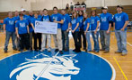 John Greenwood, supporters gather at midcourt for check presentation