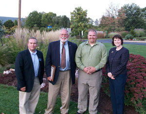 From left, Carl J. Bower, a horticulture instructor at Pennsylvania College of Technology%3B William D. Wells, retired chairman and chief executive officer of W.D. Wells and Associates Inc.%3B Adrian Karver, area manager for Ruppert Landscape%3B and Mary A. Sullivan, dean of the college%E2%80%99s School of Natural Resources Management, gather near the Schneebeli Earth Science Center entrance.