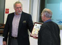 The FAA's Jim Pool, left, presents the Wright Brothers Master Pilot Award to Dana Smith