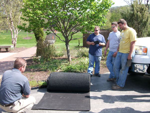 Landscape students learn about an Inca drain, among the materials recommended to divert stormwater from a natural roof.